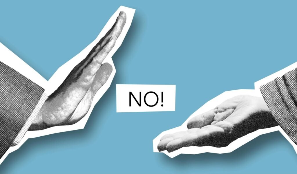 Duas mãos com a palavra Não em inglês